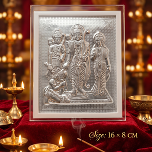 Decorative metal panel with figures on a red fabric background with candles and incense.