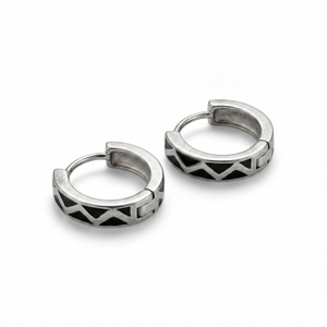 Pair of silver hoop earrings with geometric design on a white background