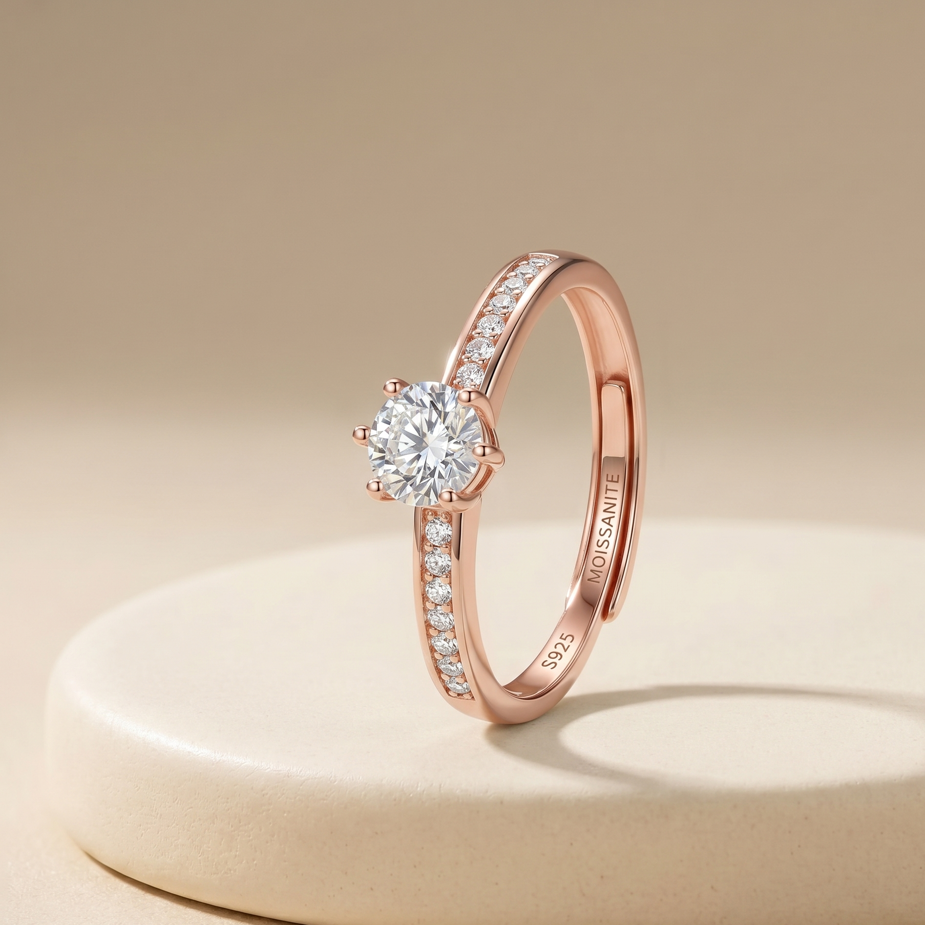 Rose gold diamond ring on a beige background