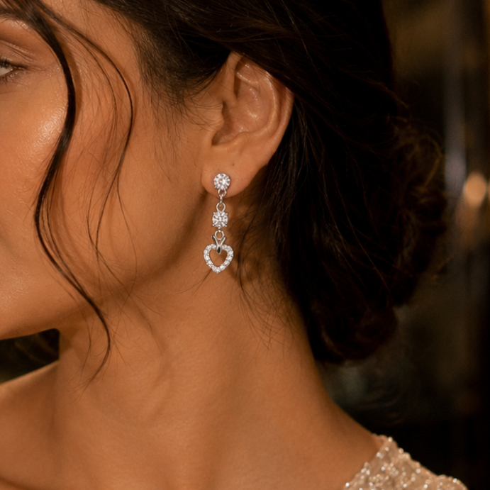 Close-up of a woman wearing elegant earrings with a blurred background