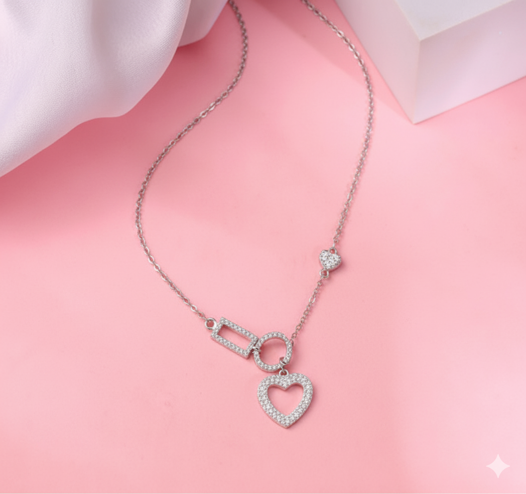 Lustra “HeartBeat” Pendant in sterling silver with crystal pavé hearts and modern shapes