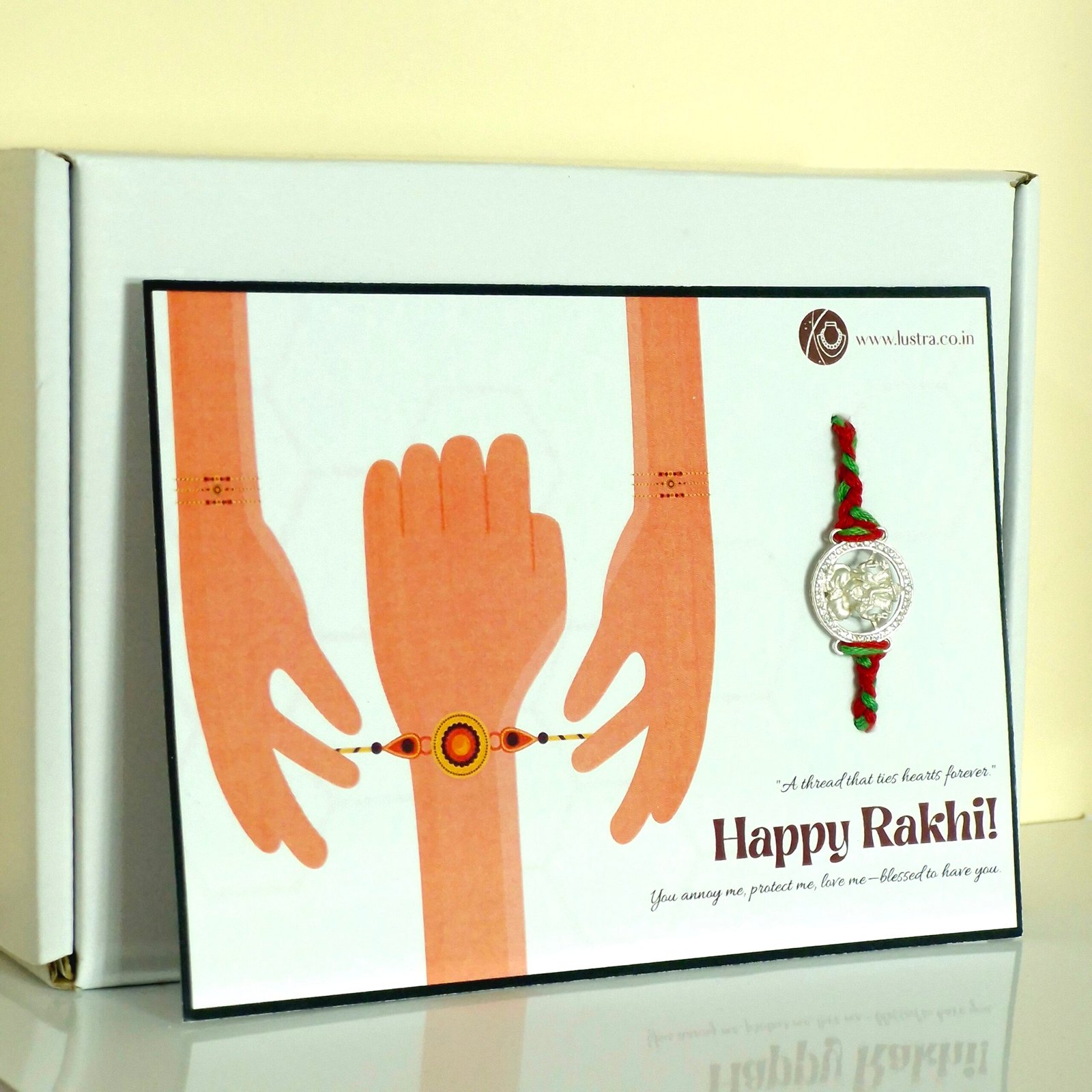 Buy Silver Ganesha Rakhi Hamper Online | Rakhi Gift Box with Sweets – Lustra