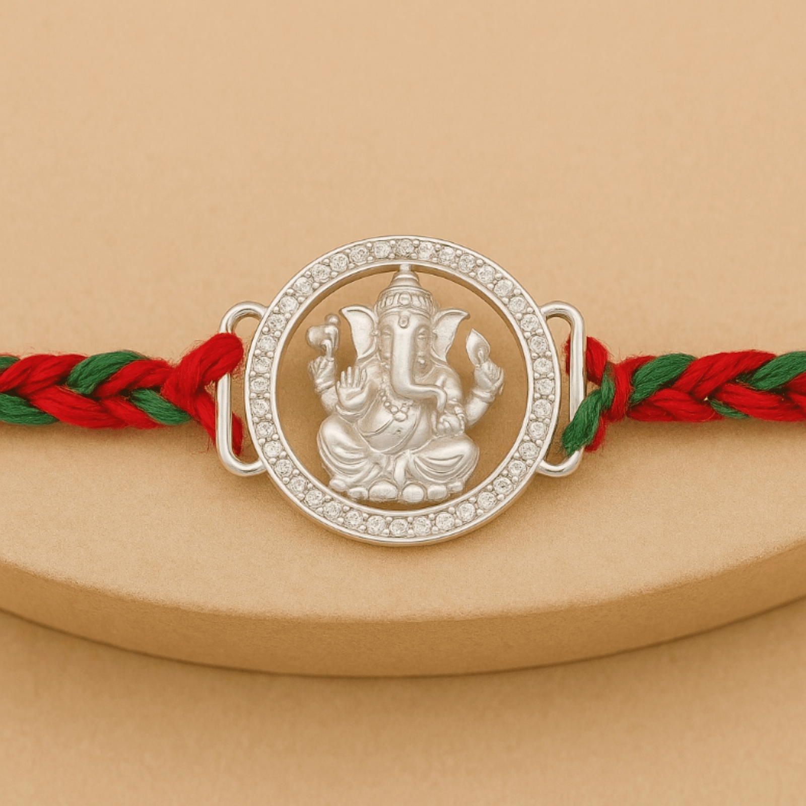 Ganesha Rakhi – Diamond-Cut Frame & Braided Thread | Lustra Silver