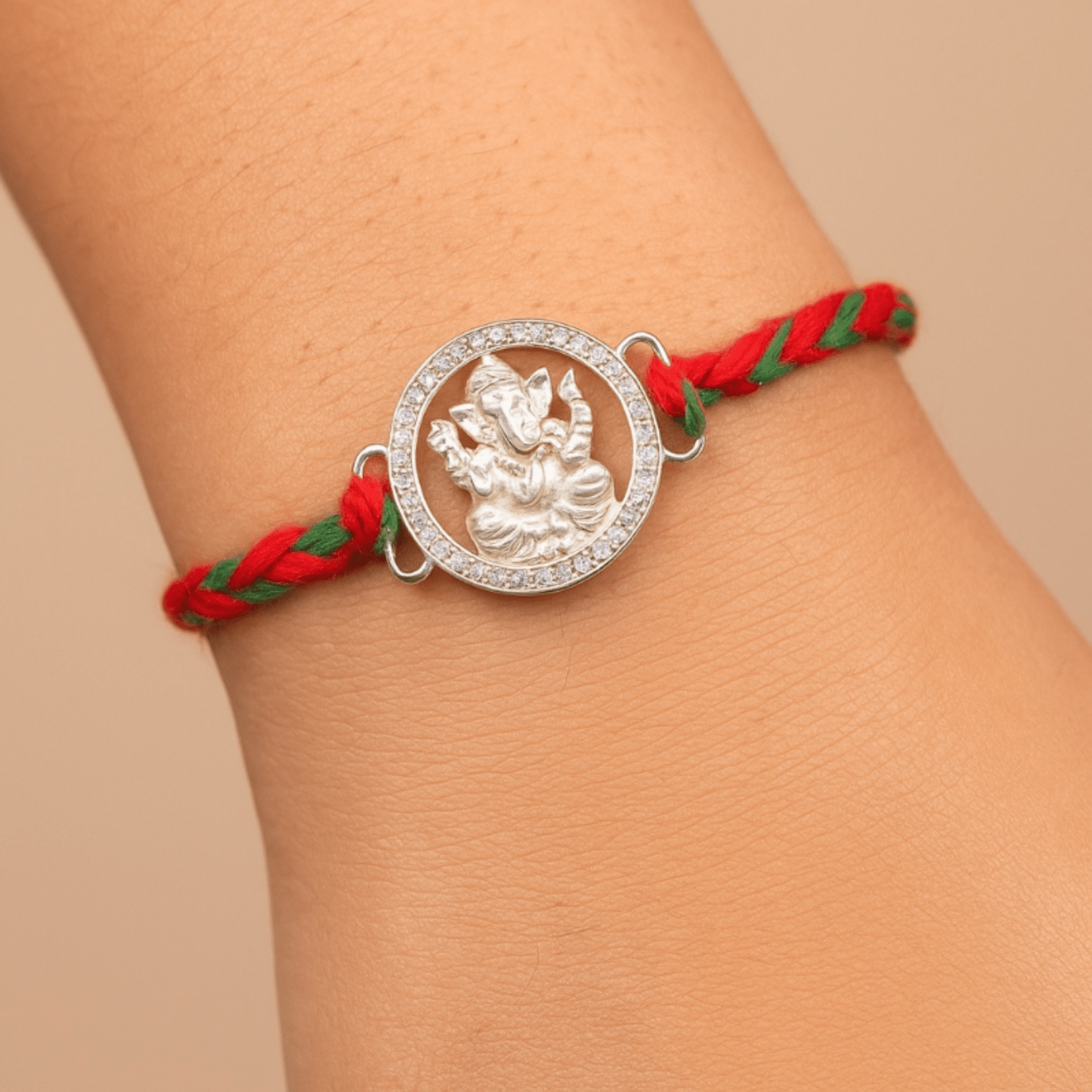 Ganesha Rakhi – Diamond-Cut Frame & Braided Thread | Lustra Silver