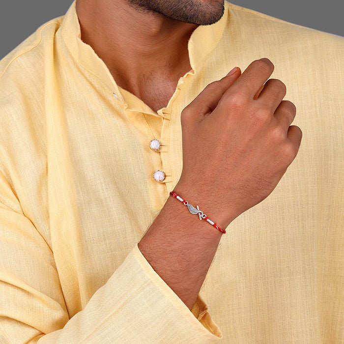 Infinity Feather Rakhi – Red Thread & Toggle Lock | Lustra Raksha Bandhan