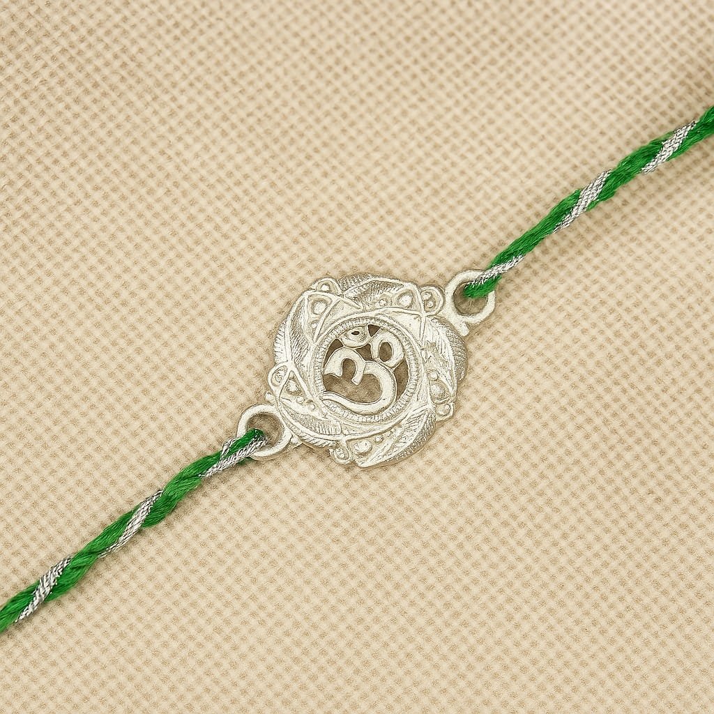 Antique Om Rakhi – Silver Round Medallion | Green Thread | Lustra