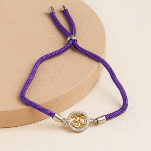 Om Rakhi with Crystal Studded Frame – Adjustable Purple Thread